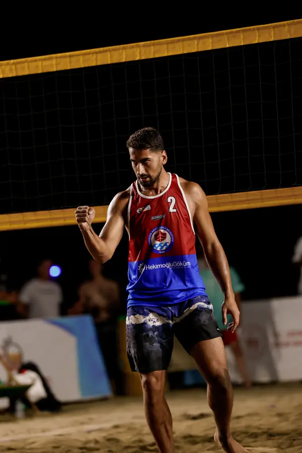 Male player, number 2, under night lights